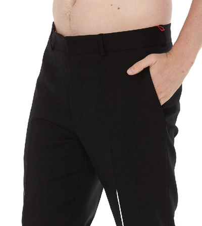 Shop Alexander Mcqueen Slashed Dart Trousers In Black