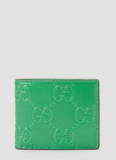 Shop Gucci Gg Embossed Wallet In Green