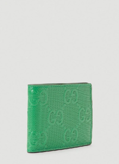 Shop Gucci Gg Embossed Wallet In Green