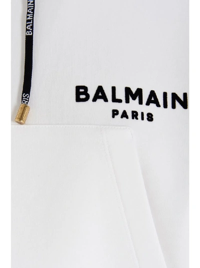 Shop Balmain Flocked Logo Cropped Hoodie In White