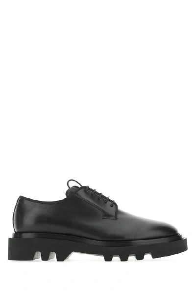 Shop Givenchy Logo Embossed Derby Shoes In Black