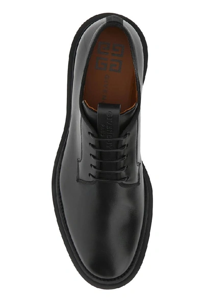 Shop Givenchy Logo Embossed Derby Shoes In Black