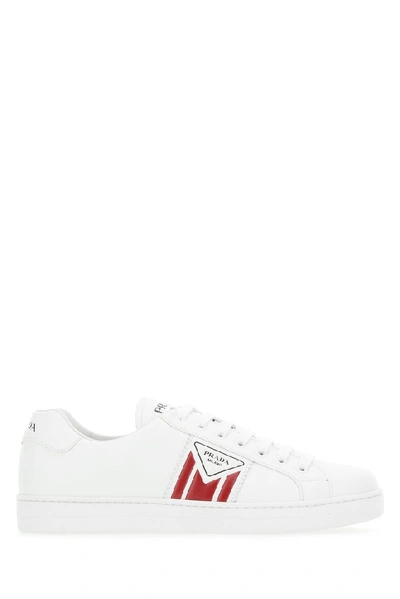 Shop Prada Embossed Logo Sneakers In White