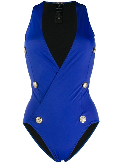 Shop Balmain Buttoned Wrap Swimsuit In Blue