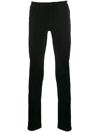 Shop Dolce & Gabbana Embroidered Motif Slim-fit Jeans In Black