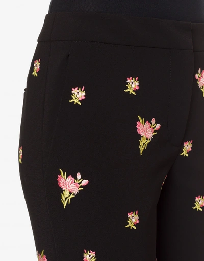 Shop Moschino Crêpe Pants Flowers Embroidery In Black