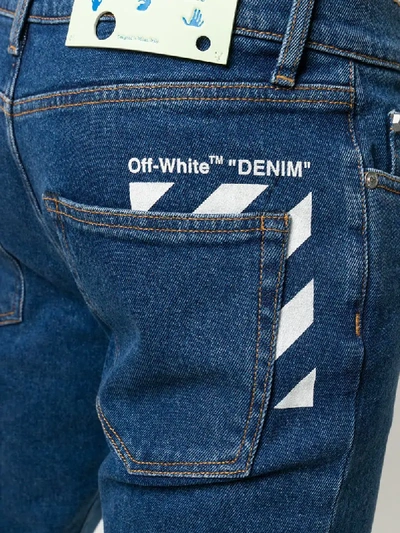 Shop Off-white Diagonal Pocket Skinny Jeans In Blue