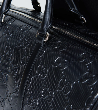 GUCCI GUCCISSIMA BLACK EMBOSSED LEATHER DUFFLE BAG