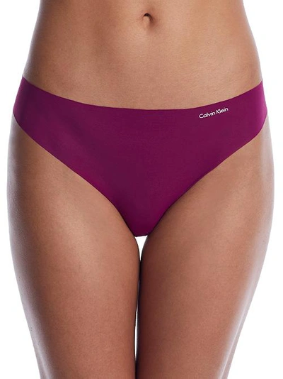 Shop Calvin Klein Invisibles Thong In Loyal