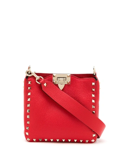 Shop Valentino Rockstud Logo Crossbody Bag In Red