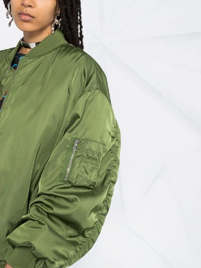 Shop Moschino Oversized Bomber Jacket In Green