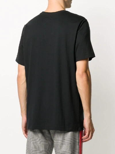 Shop Nike Graphic Print Cotton T-shirt In Black