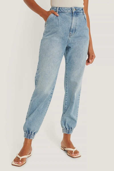 Shop Na-kd Reborn Organic Elastic Hem Loose Leg Jeans Blue In Mid Blue