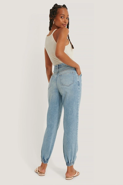 Shop Na-kd Reborn Organic Elastic Hem Loose Leg Jeans Blue In Mid Blue