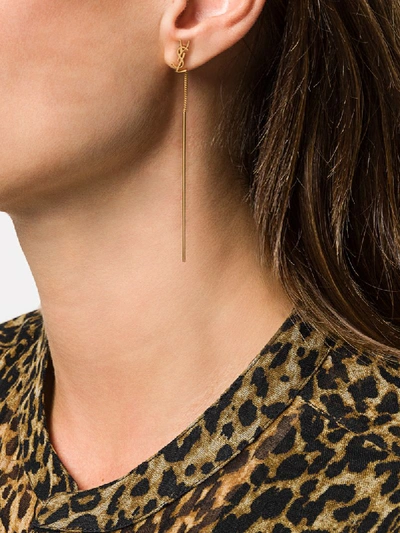 Shop Saint Laurent Opyum Long Earrings In Gold