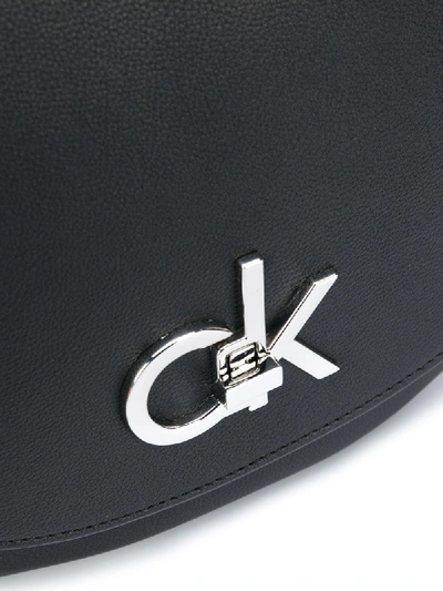 Shop Calvin Klein Re-lock Logo Crossbody Bag In Black