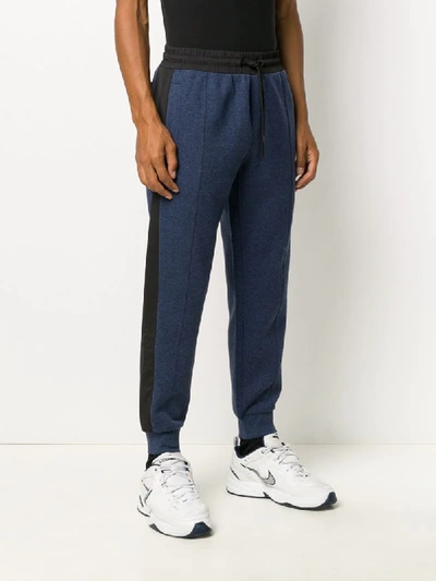 Shop Calvin Klein Side Stripe Tapered Track Trousers In Blue