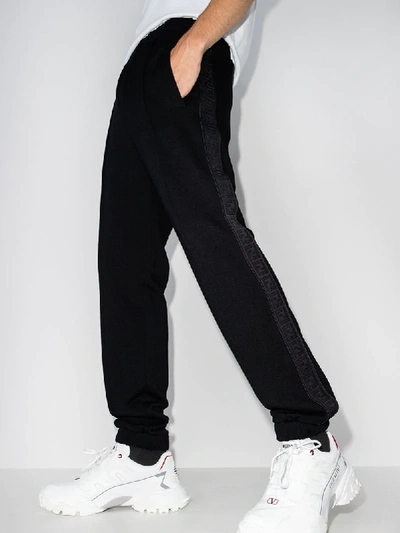 Shop Fendi Logo Tape Track Pants In Black