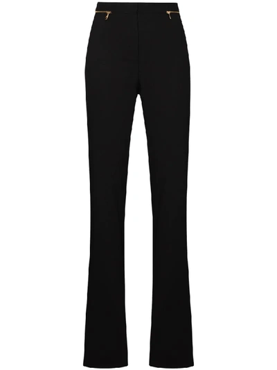 Shop Versace Flared Trousers In Black