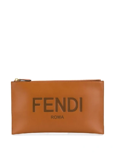 Shop Fendi Debossed Logo Clutch Bag In Brown