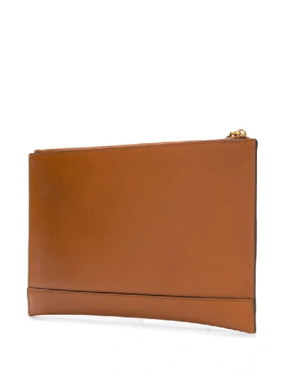 Shop Fendi Debossed Logo Clutch Bag In Brown