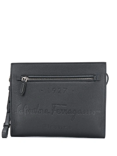 Shop Ferragamo Debossed-logo Clutch Bag In Black