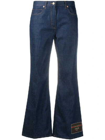 Shop Gucci Flared Jeans With Logo Patch At Leg In Blue