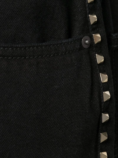 Shop Valentino Wide-leg Rockstud Jeans In Black