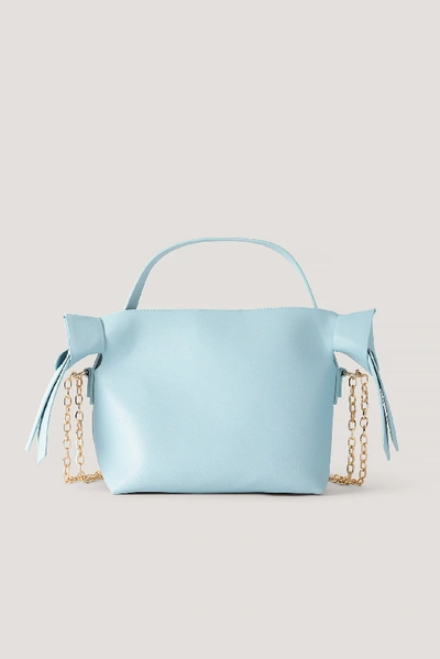 Shop Hanna Schönberg X Na-kd Chain Detail Knot Bag Blue In Light Blue