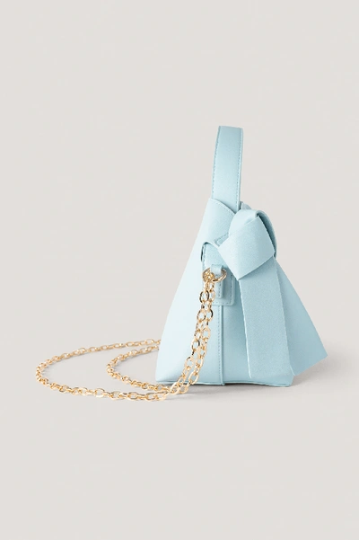 Shop Hanna Schönberg X Na-kd Chain Detail Knot Bag Blue In Light Blue