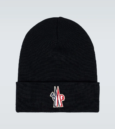 Shop Moncler Knitted Wool Beanie In Black
