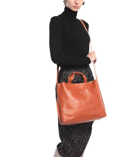 Shop Il Bisonte Handbag In Tan