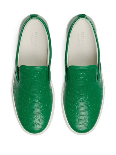 Shop Gucci Gg-embossed Slip-on Sneakers In Green