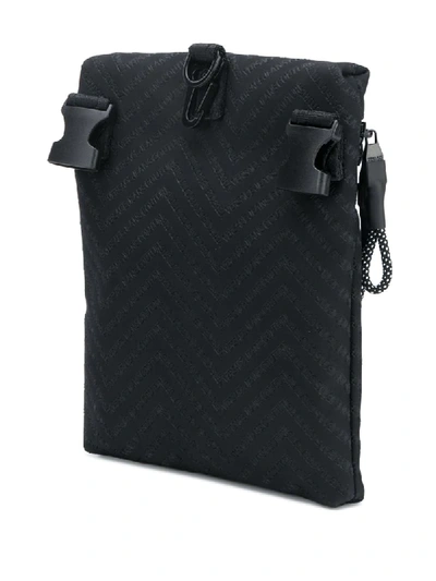 Shop Versace Jeans Couture Embossed Logo Messenger Bag In Black