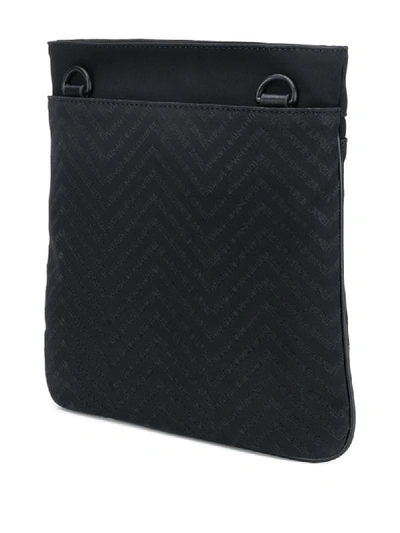 Shop Versace Jeans Couture Embossed Logo Messenger Bag In Black