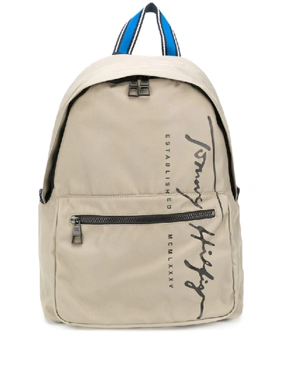 Shop Tommy Hilfiger Logo Print Zipped Backpack In Neutrals