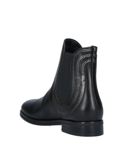 Shop Alaïa Ankle Boots In Black