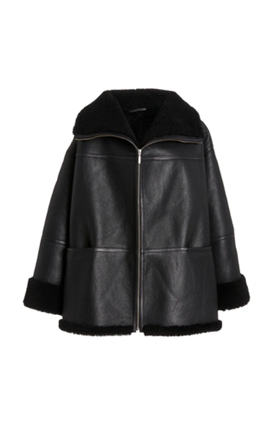 Shop Totême Menfi Oversized Shearling Coat In Black