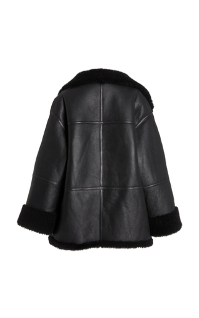 Shop Totême Menfi Oversized Shearling Coat In Black