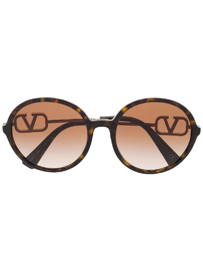 Shop Valentino Vlogo Round Sunglasses In Brown