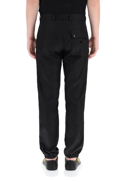 Shop Prada Logo Elasticated Cuff Trousers In Black