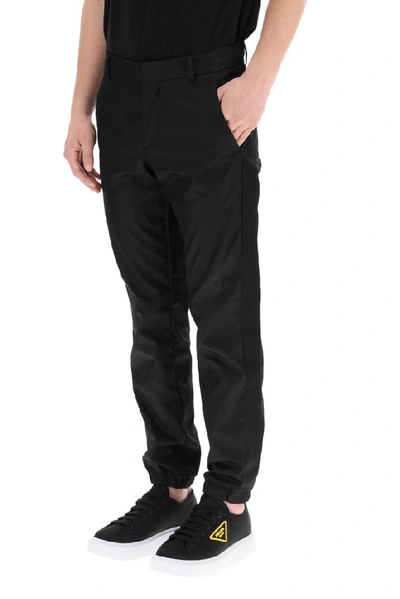 Shop Prada Logo Elasticated Cuff Trousers In Black