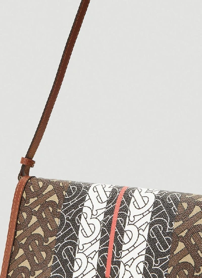 Shop Burberry Monogram Stripe Print Strap Wallet In Brown