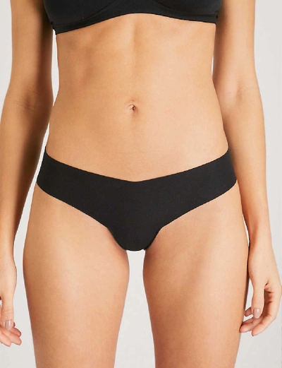 Shop Commando Stretch-cotton Thong In Black