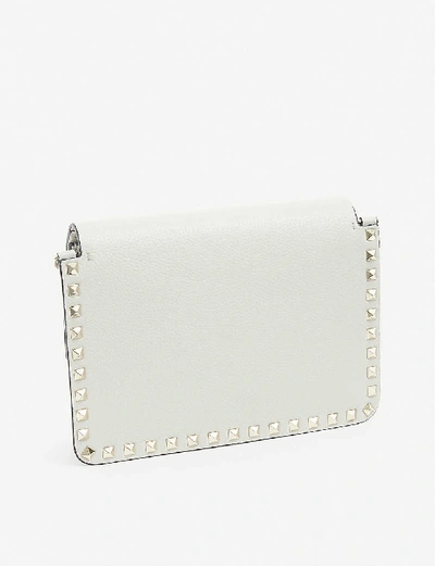 Shop Valentino Rockstud Leather Cross-body Bag In Opal Grey