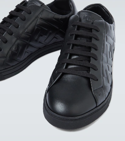 Shop Fendi Embossed Leather Sneakers In Black