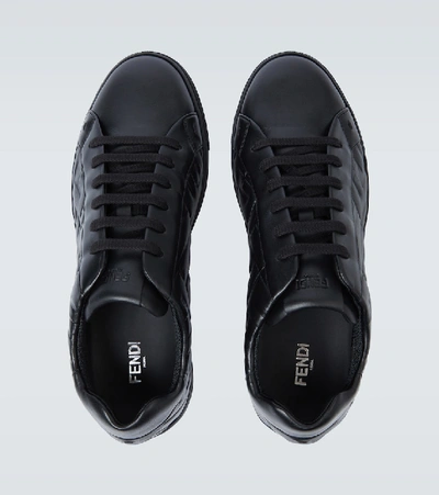 Shop Fendi Embossed Leather Sneakers In Black