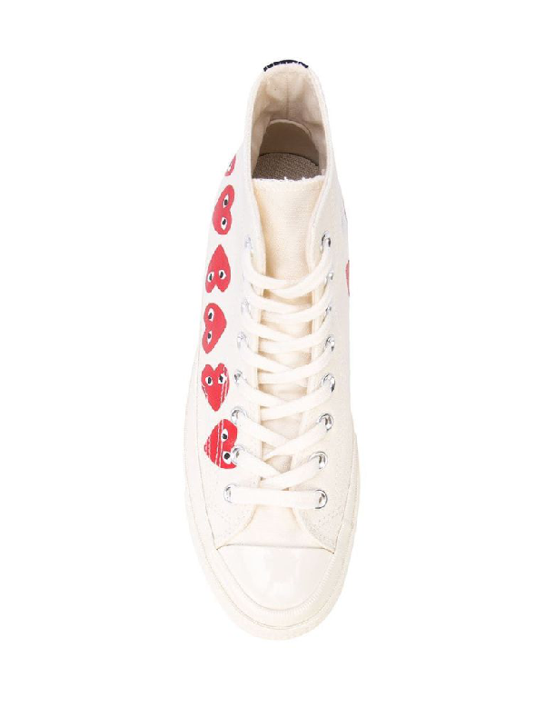 white converse with a heart
