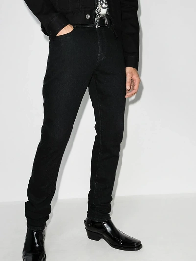 Shop Saint Laurent Five Pocket Skinny Jeans In Black