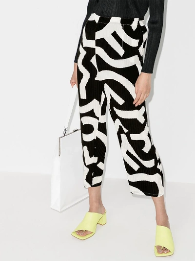 Shop Issey Miyake Plissé Pattern Cropped Trousers In Black